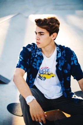 A young man wearing a statement t-shirt